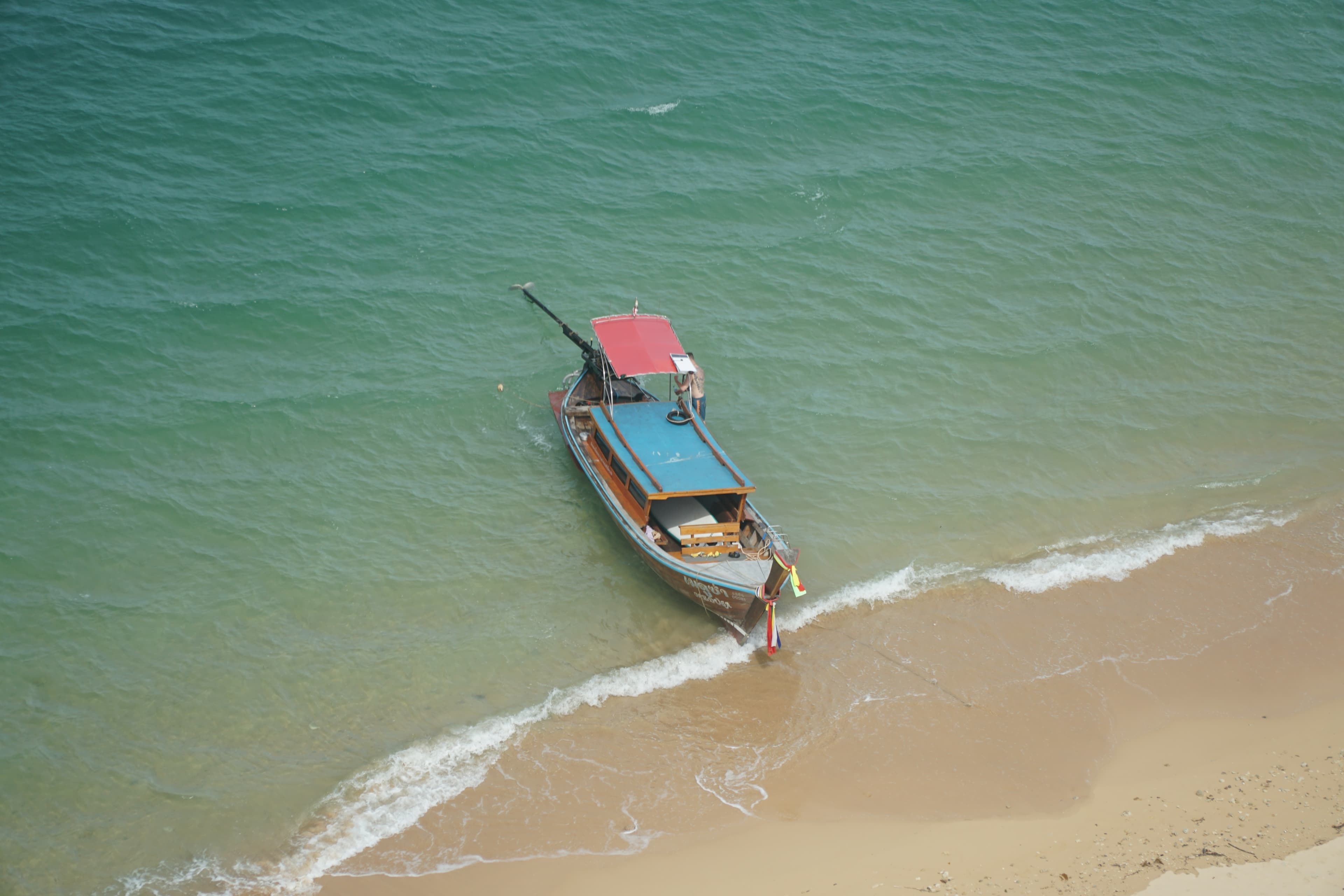 Longtail boat at a scenic tropical beach