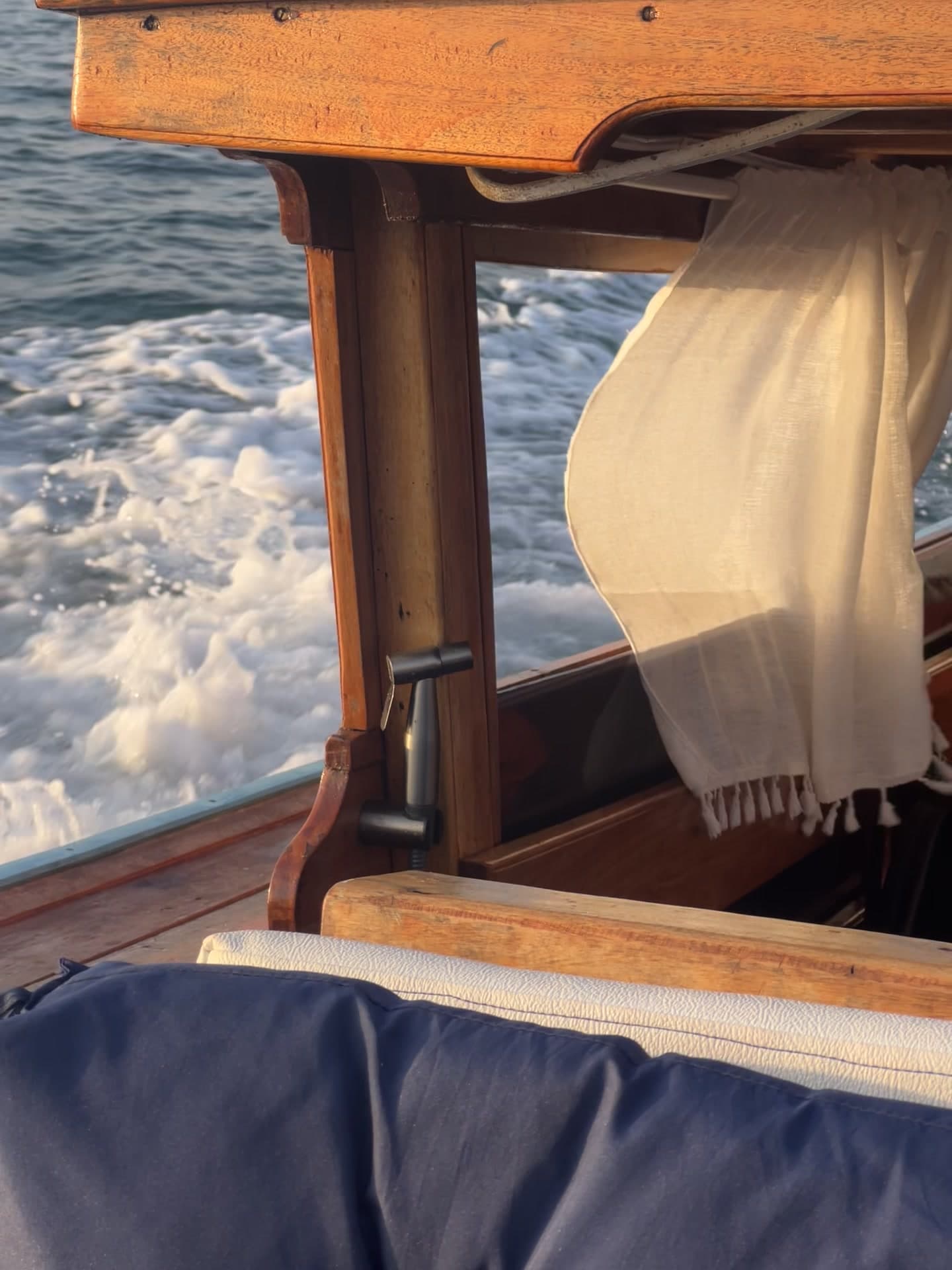 Soft evening light inside a shaded private boat