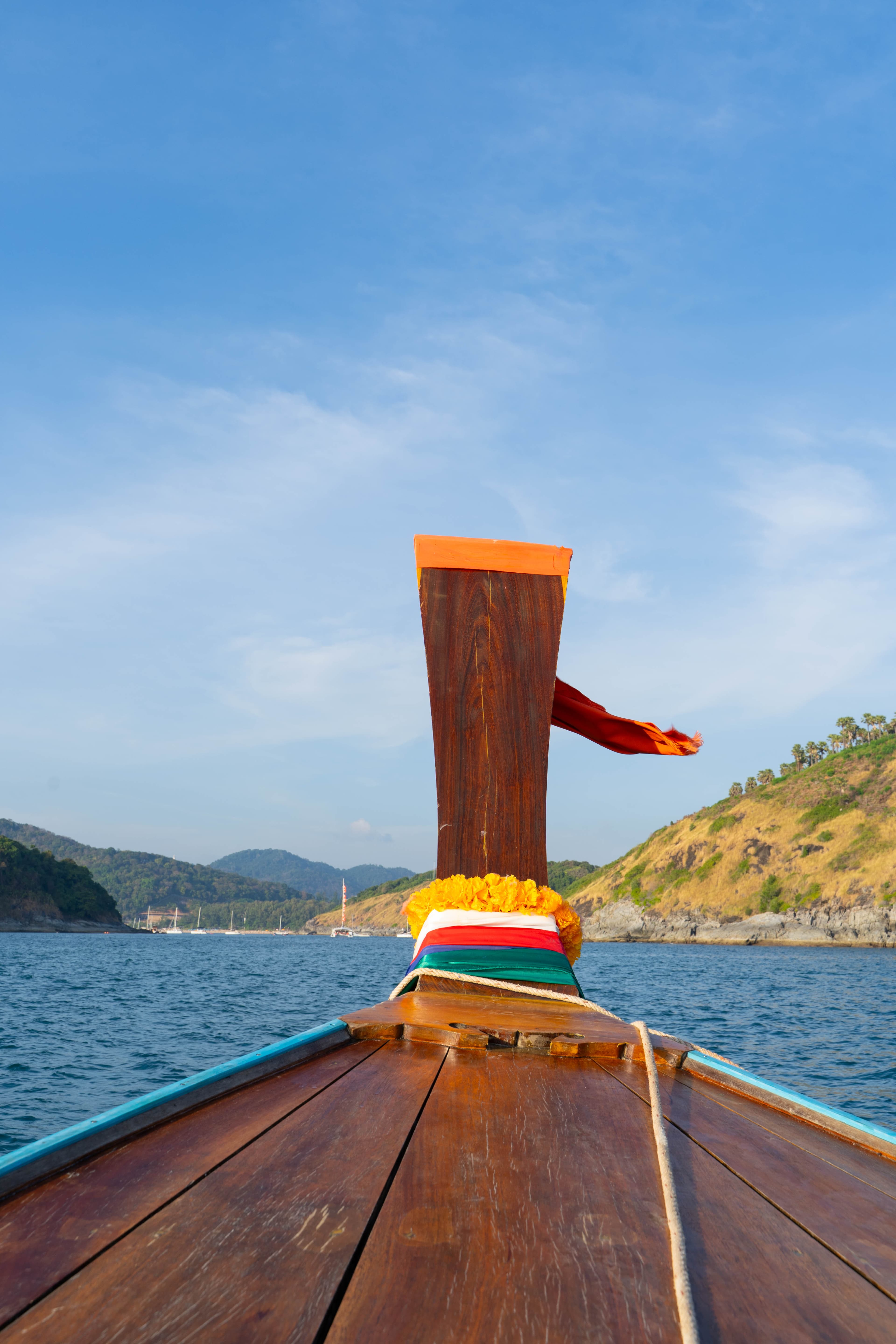 Classic longtail bow with open sea and warm sky
